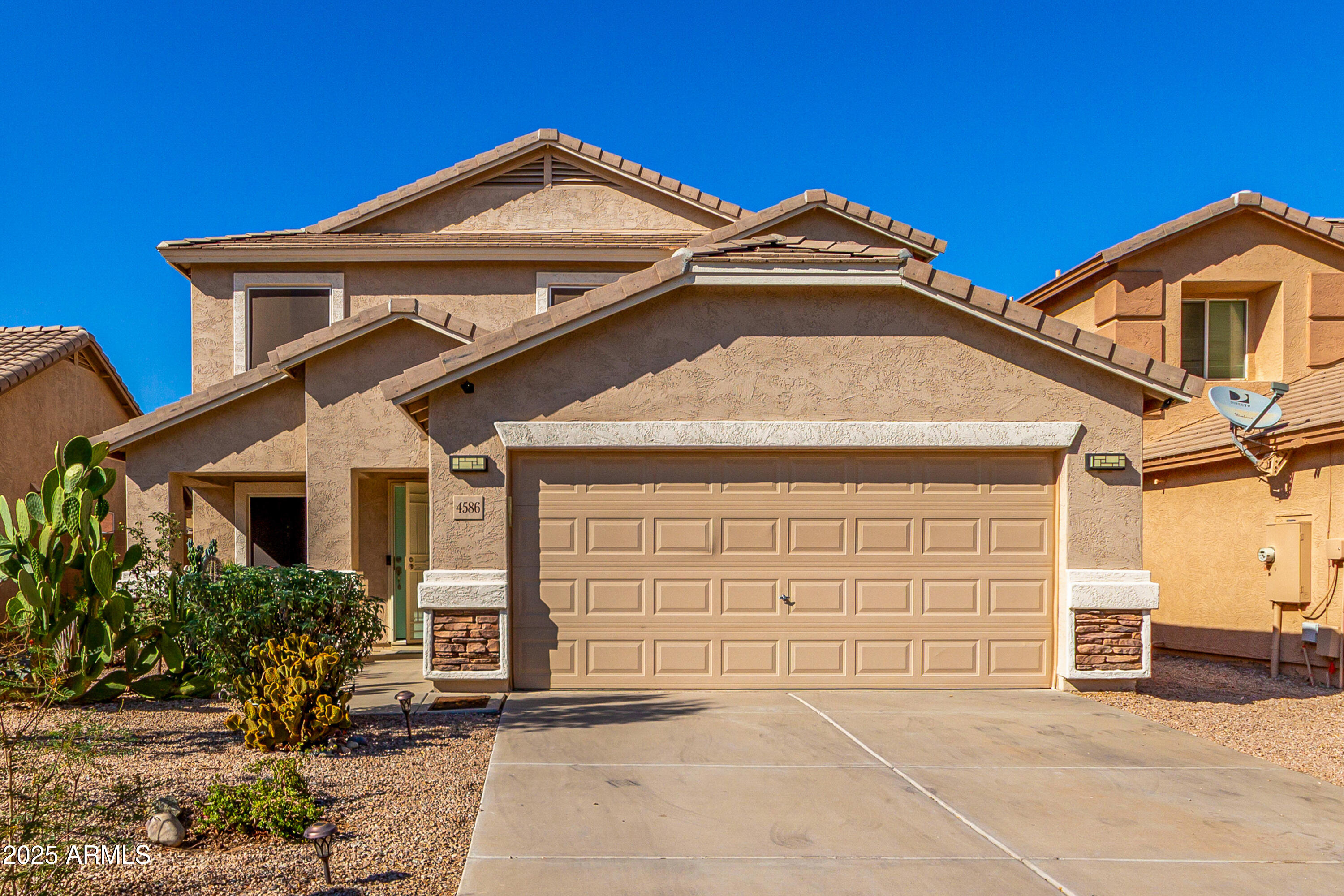 4586 East Silverbell Road San Tan Valley, AZ 85143 - Photo 1 of 32 a front view of a house with a garage
