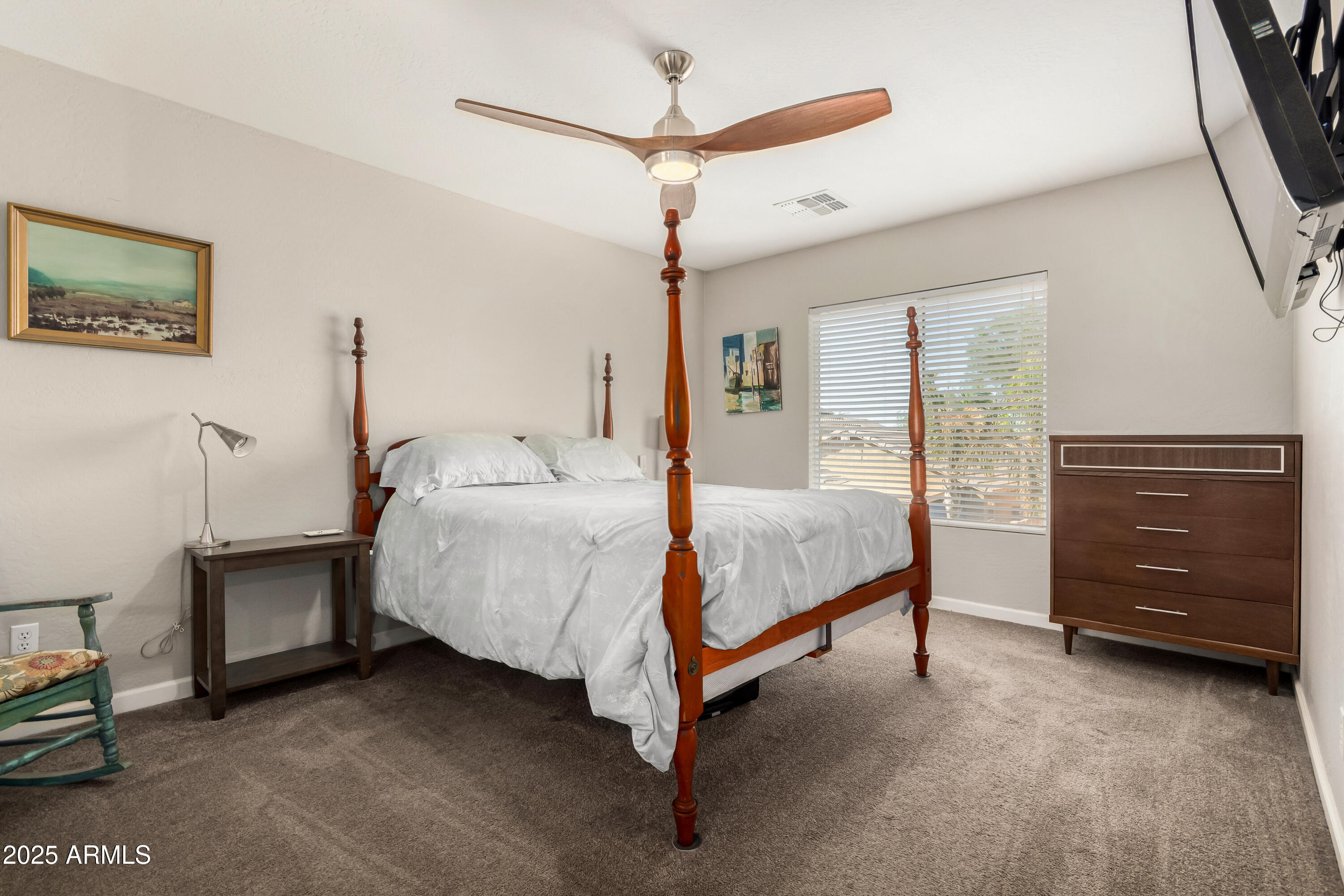 4586 East Silverbell Road San Tan Valley, AZ 85143 - Photo 13 of 32 a bed room with a bed and a ceiling fan