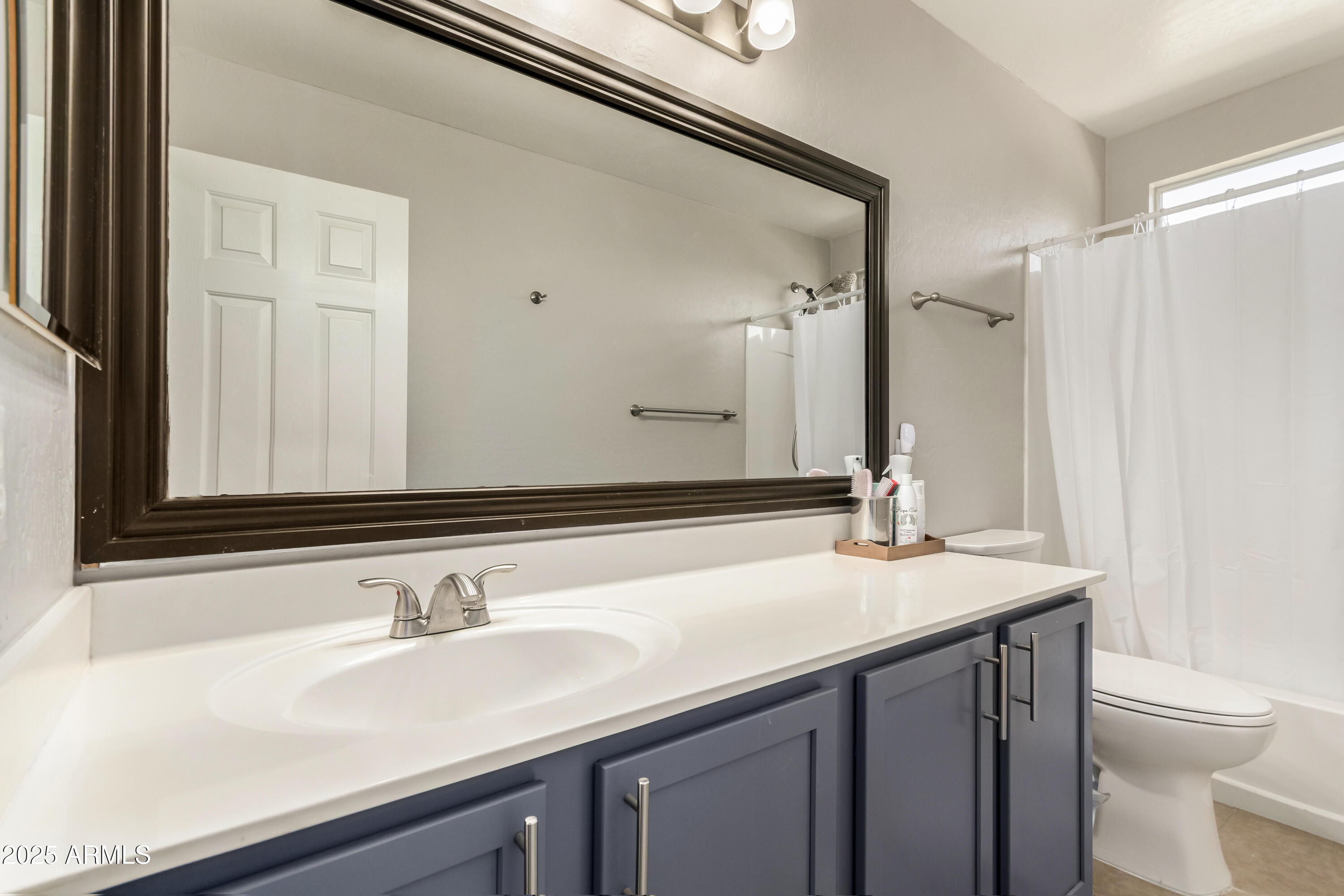 4586 East Silverbell Road San Tan Valley, AZ 85143 - Photo 16 of 32 a bathroom with a sink and a toilet