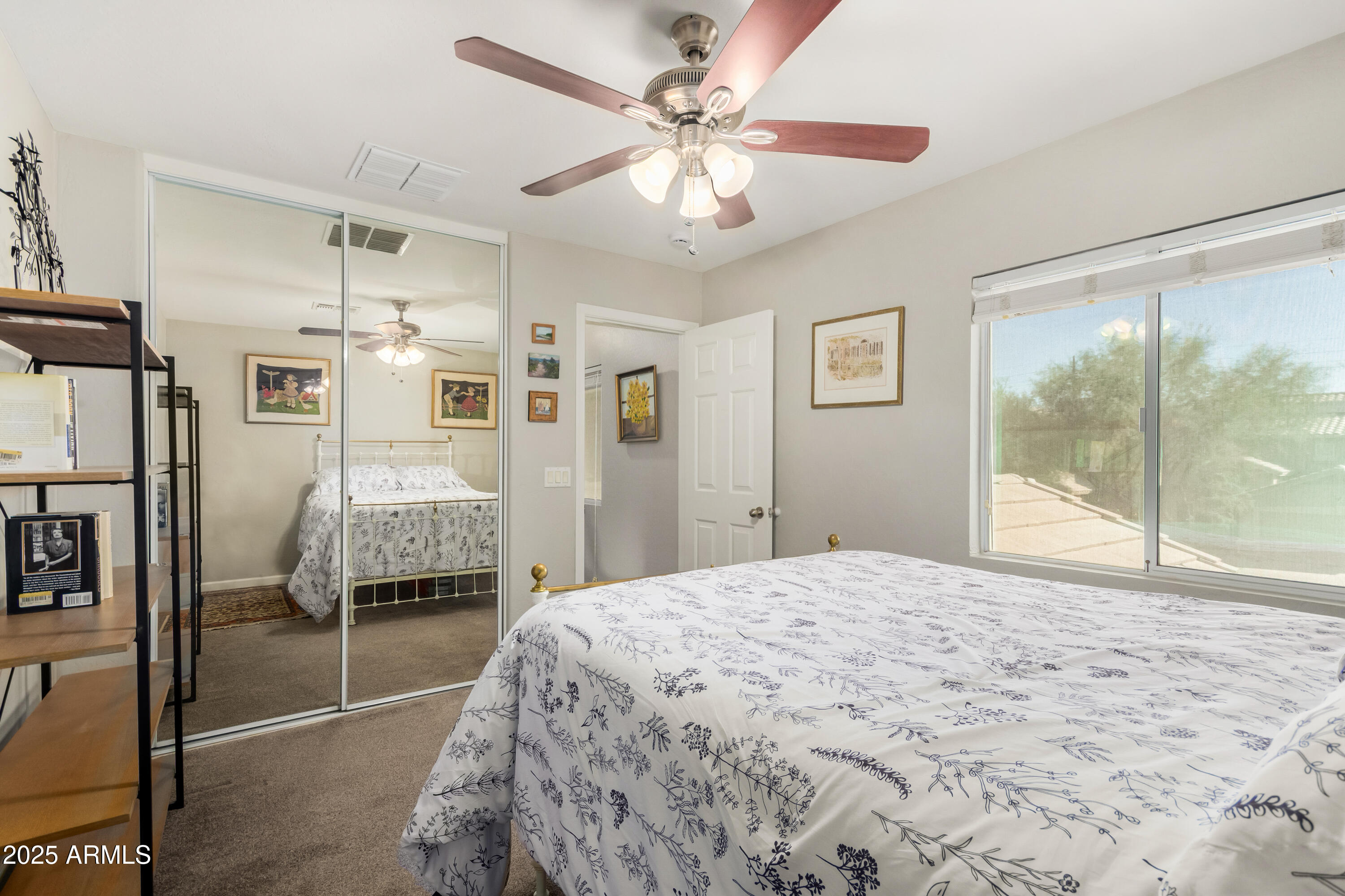 4586 East Silverbell Road San Tan Valley, AZ 85143 - Photo 19 of 32 a bedroom with a bed and a large window with the outer view