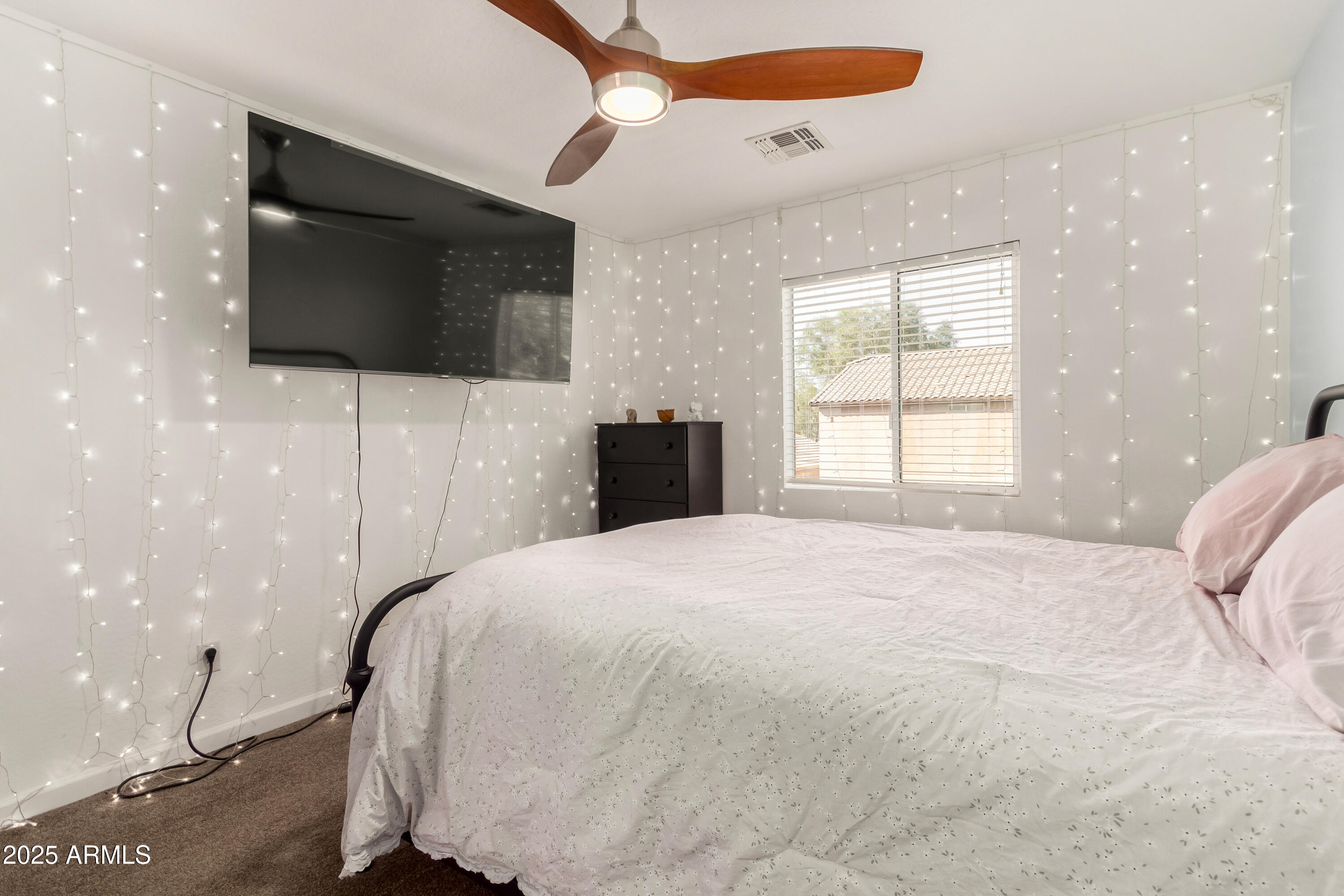4586 East Silverbell Road San Tan Valley, AZ 85143 - Photo 21 of 32 a bedroom with a bed and a flat screen tv