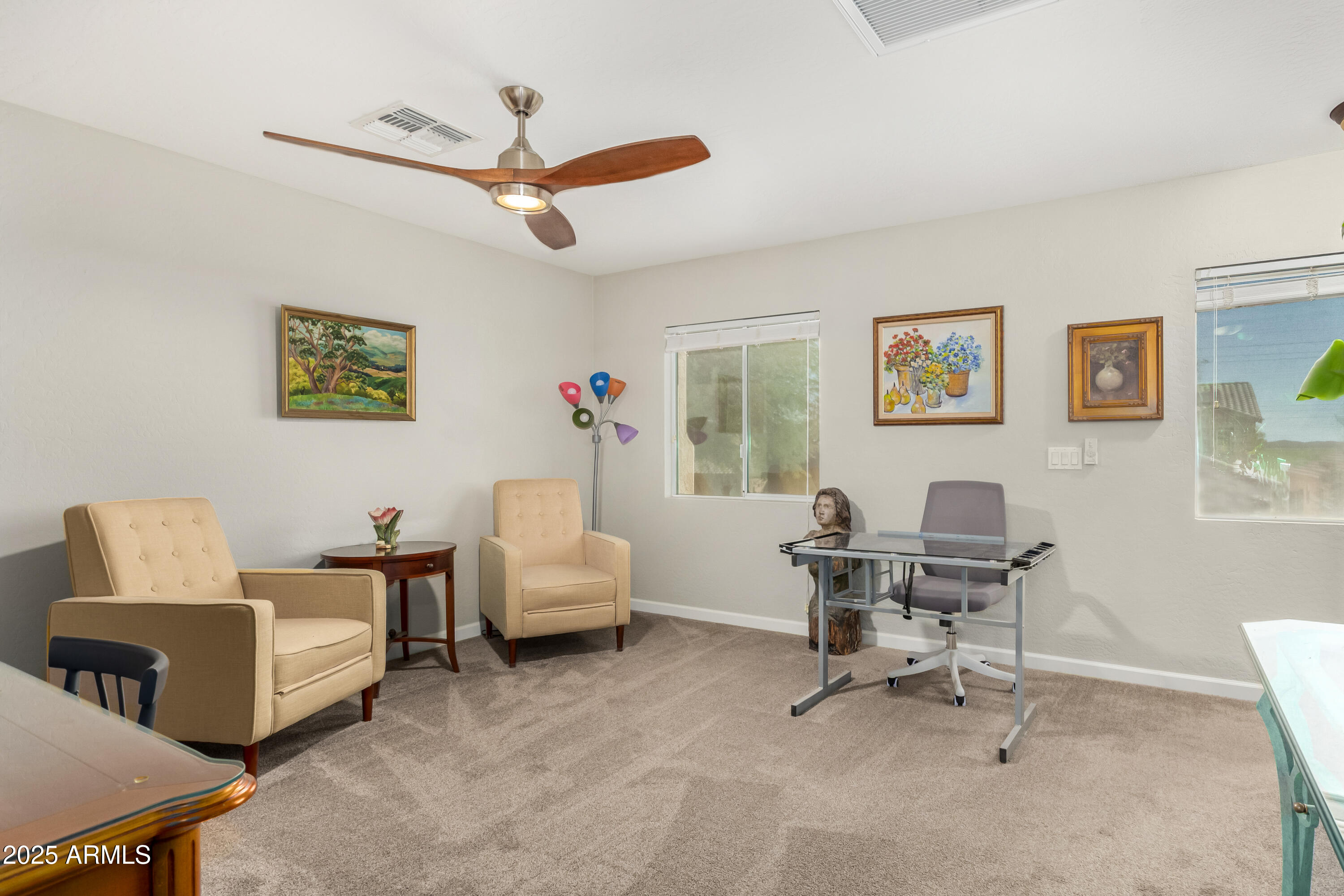4586 East Silverbell Road San Tan Valley, AZ 85143 - Photo 23 of 32 a living room with furniture and windows