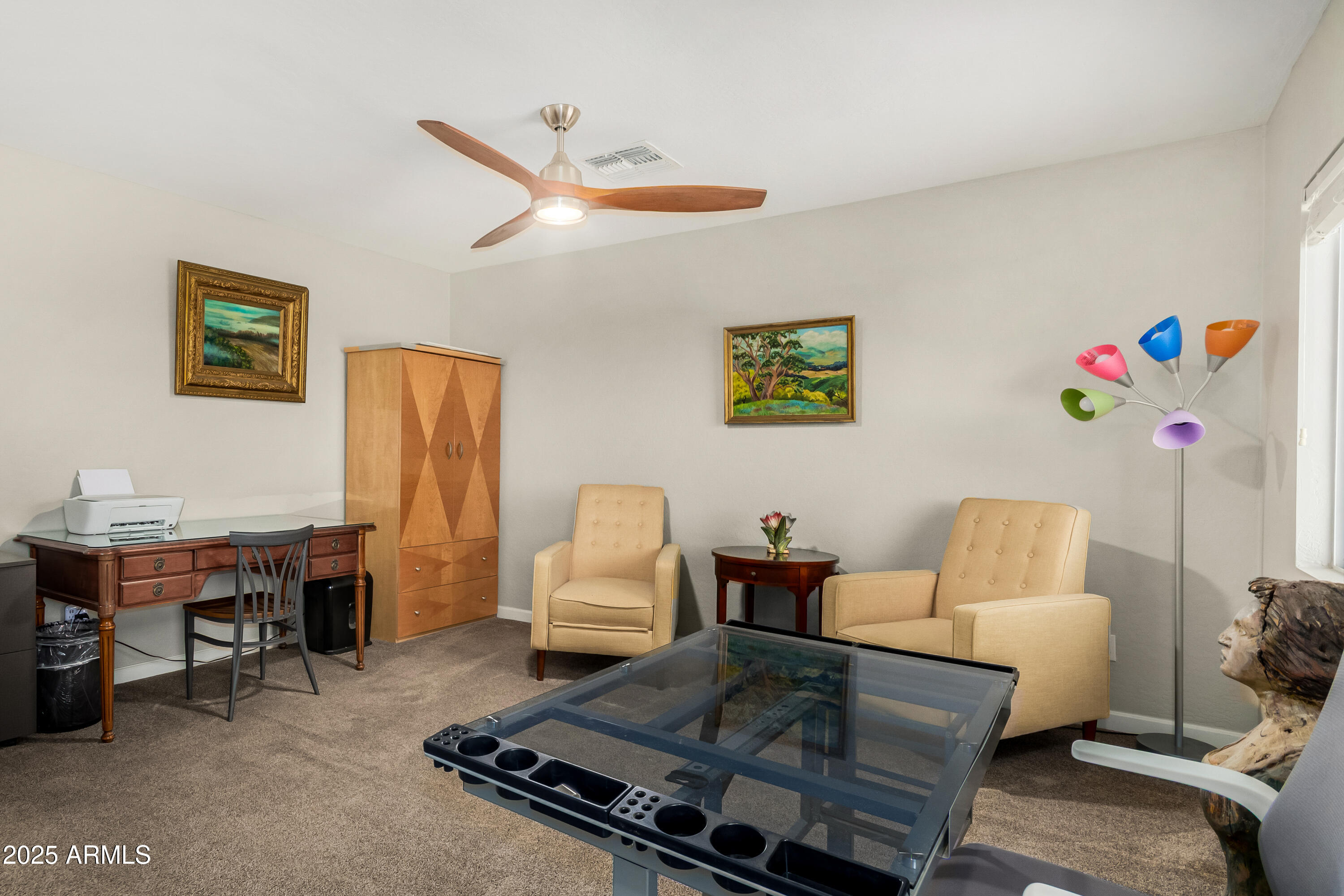 4586 East Silverbell Road San Tan Valley, AZ 85143 - Photo 24 of 32 a living room with furniture and a window