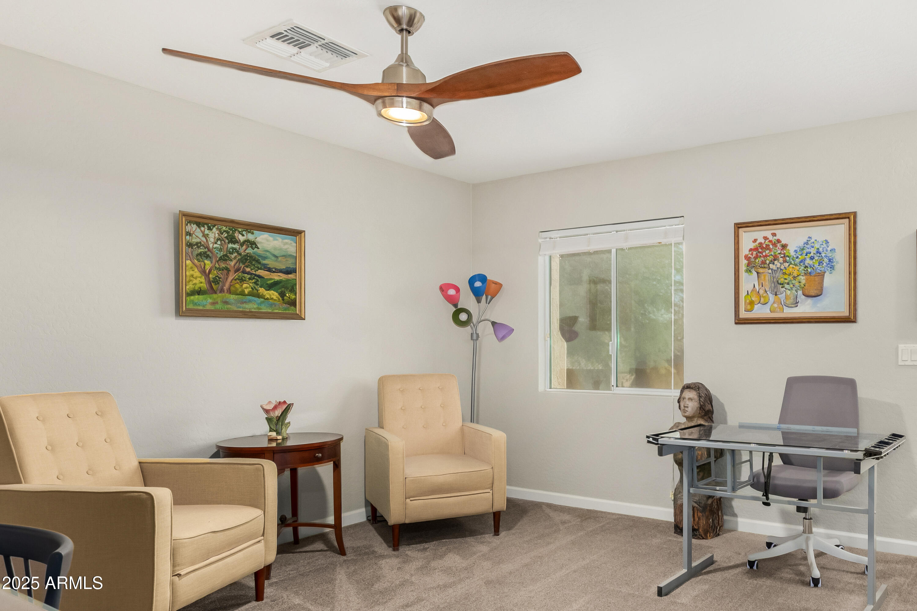 4586 East Silverbell Road San Tan Valley, AZ 85143 - Photo 25 of 32 a workspace with a couch