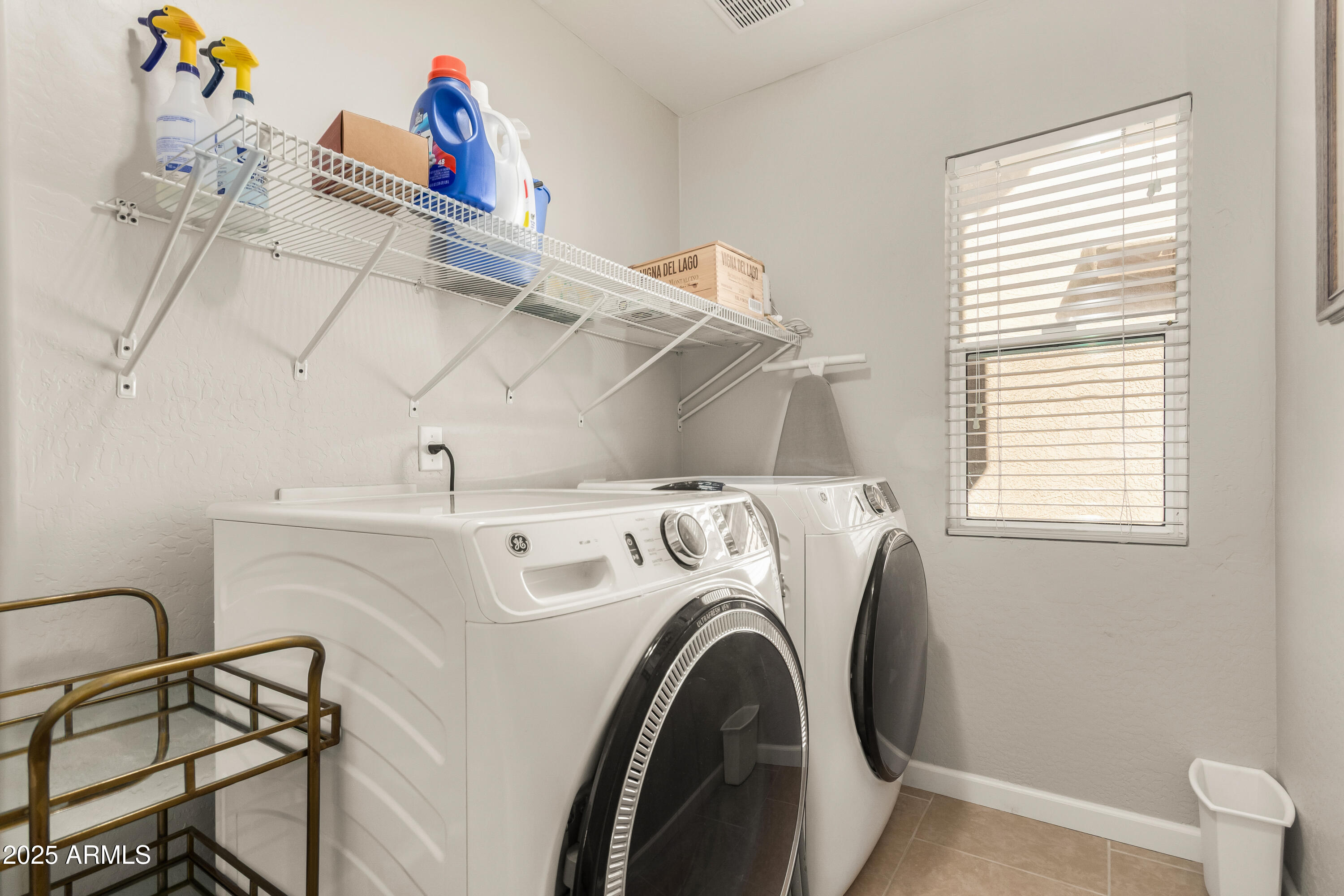 4586 East Silverbell Road San Tan Valley, AZ 85143 - Photo 26 of 32 a utility room with dryer and washer