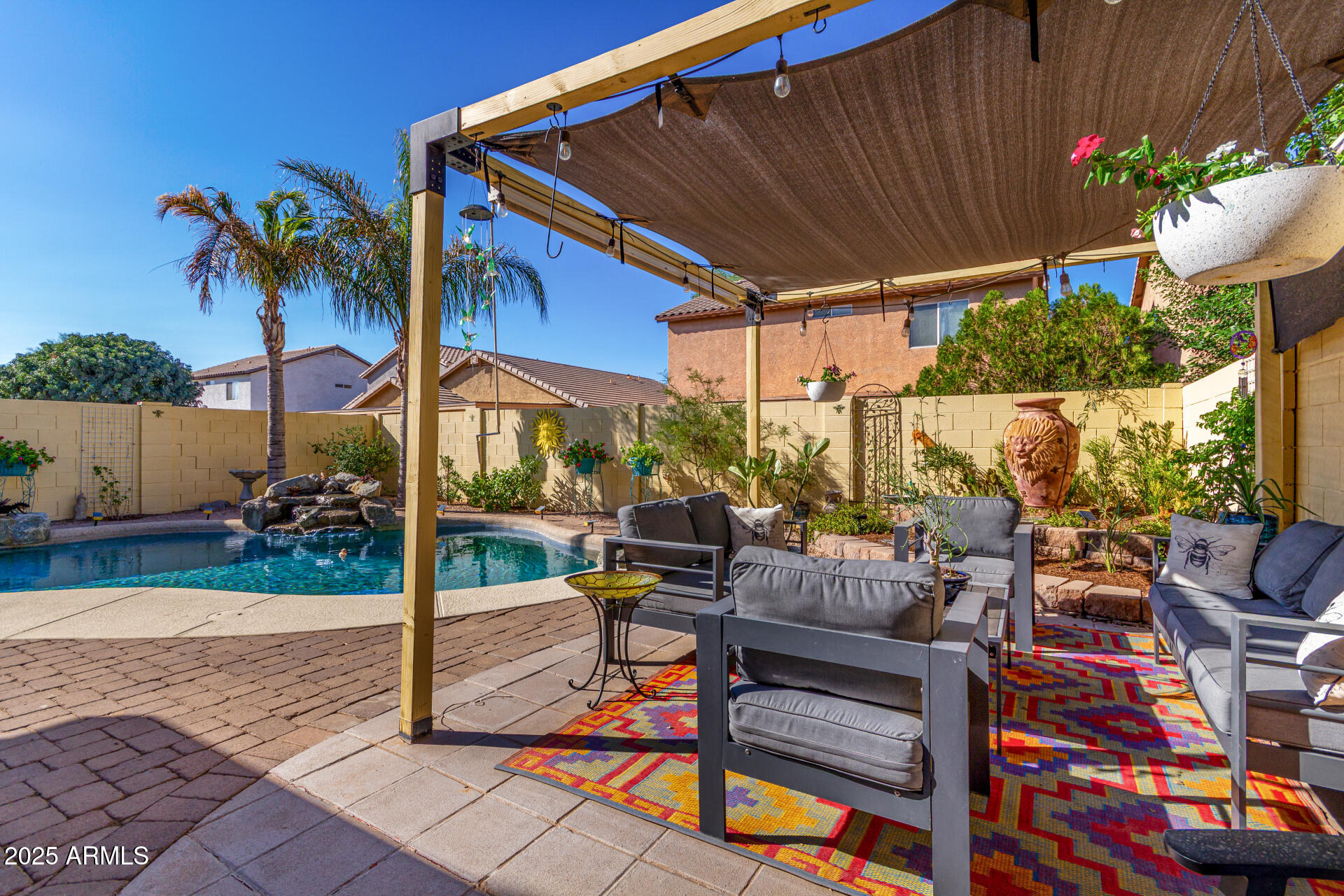 4586 East Silverbell Road San Tan Valley, AZ 85143 - Photo 29 of 32 a view of a patio with table and chairs potted plants
