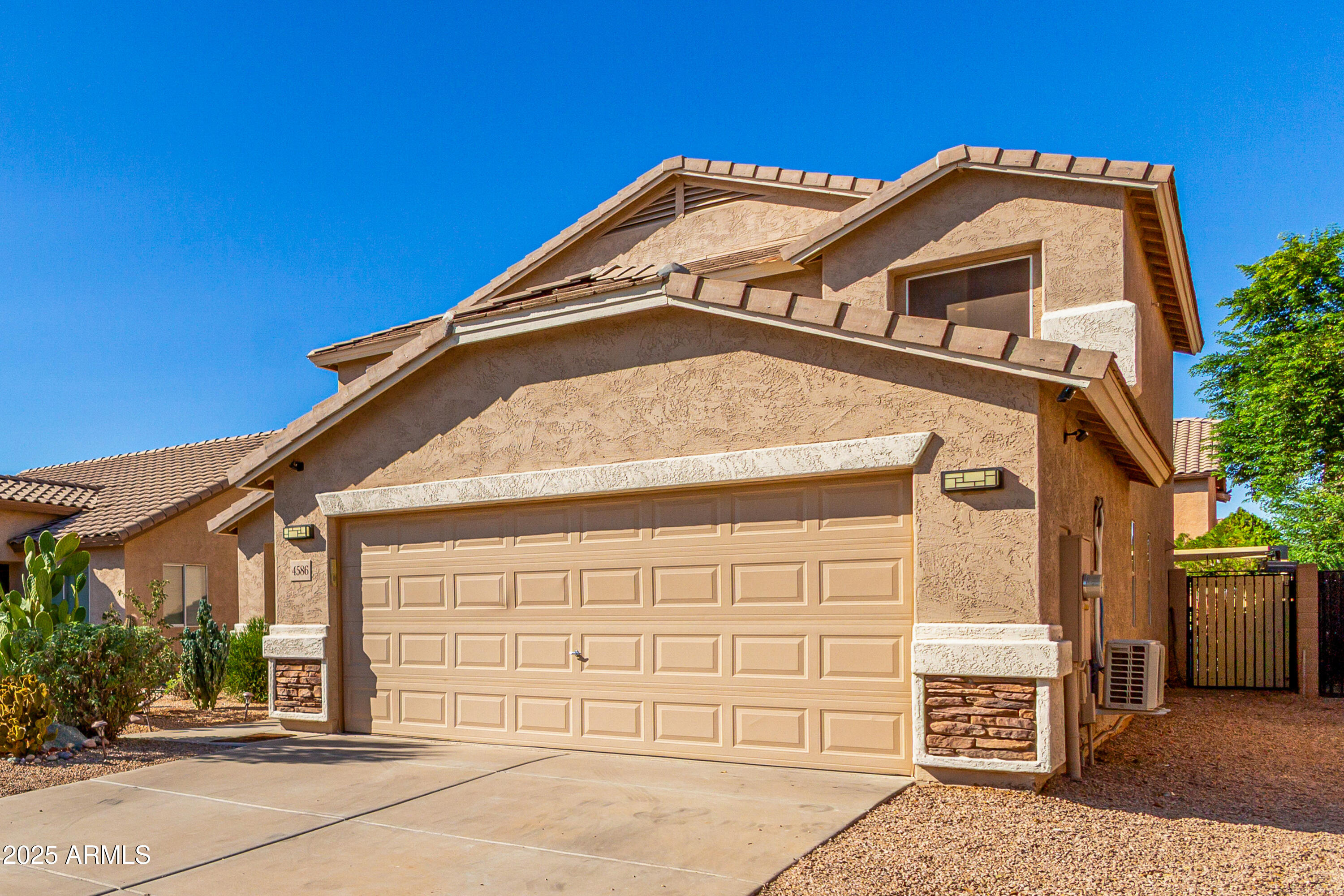 4586 East Silverbell Road San Tan Valley, AZ 85143 - Photo 3 of 32 a front view of a house