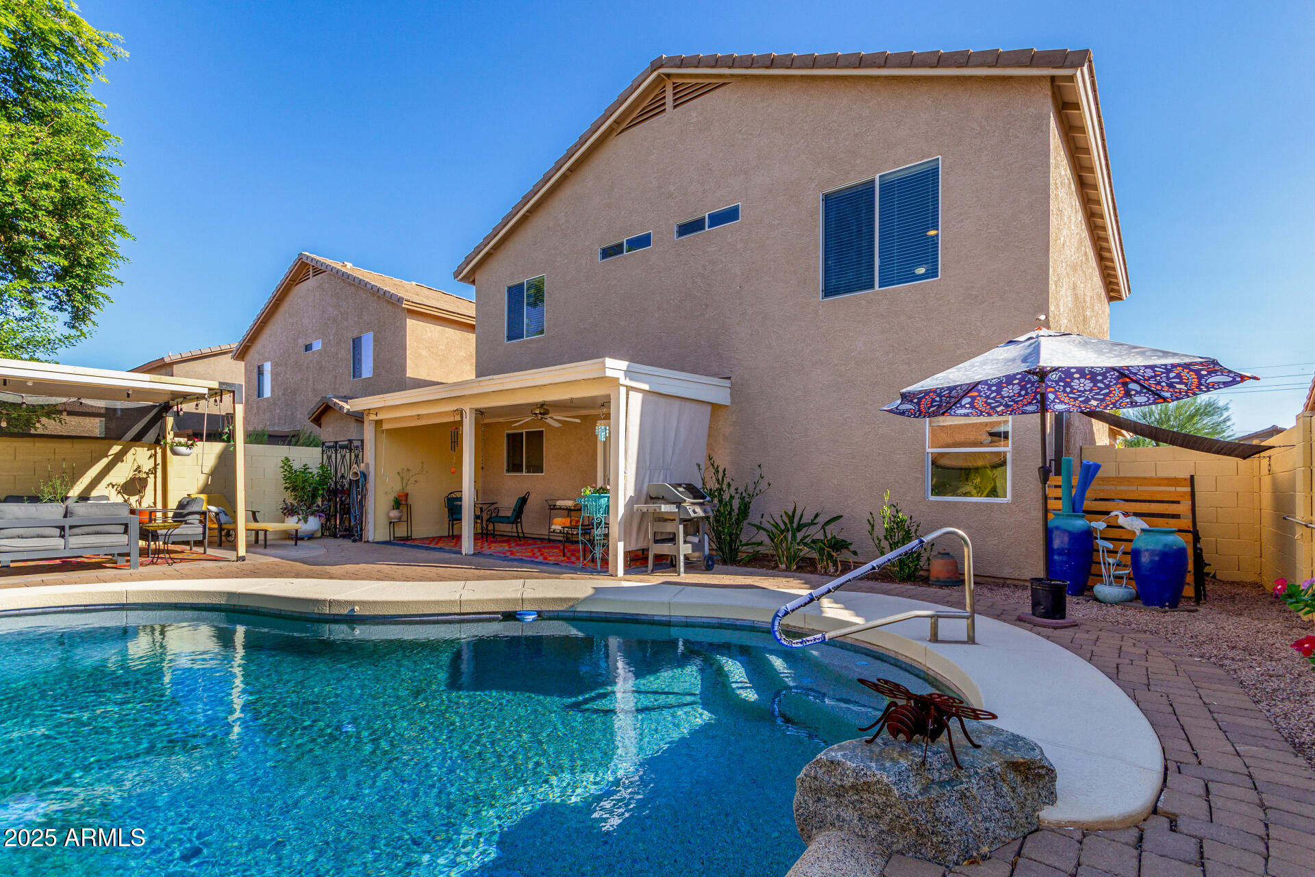 4586 East Silverbell Road San Tan Valley, AZ 85143 - Photo 31 of 32 a front view of house with yard and outdoor seating