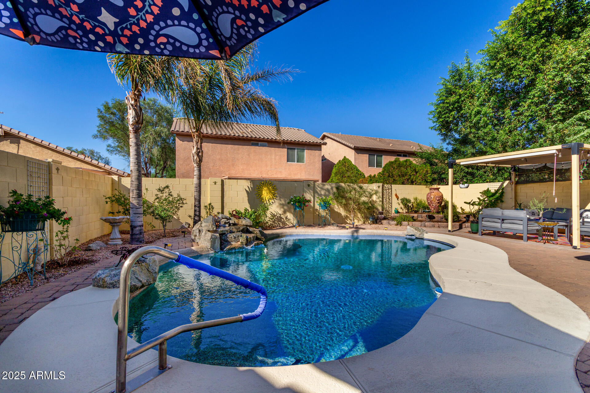 4586 East Silverbell Road San Tan Valley, AZ 85143 - Photo 32 of 32 a view of a swimming pool with a patio