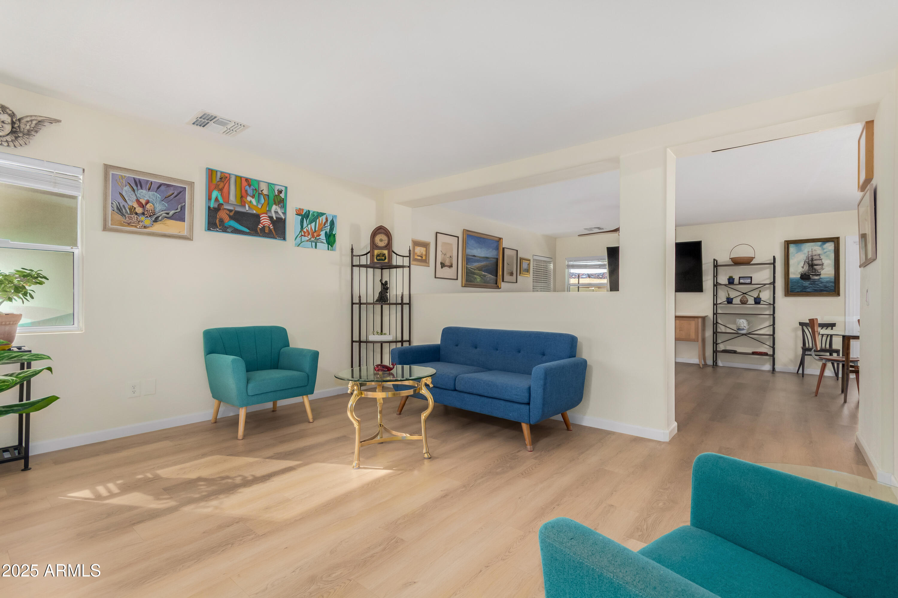 4586 East Silverbell Road San Tan Valley, AZ 85143 - Photo 5 of 32 a living room with furniture and a wooden floor