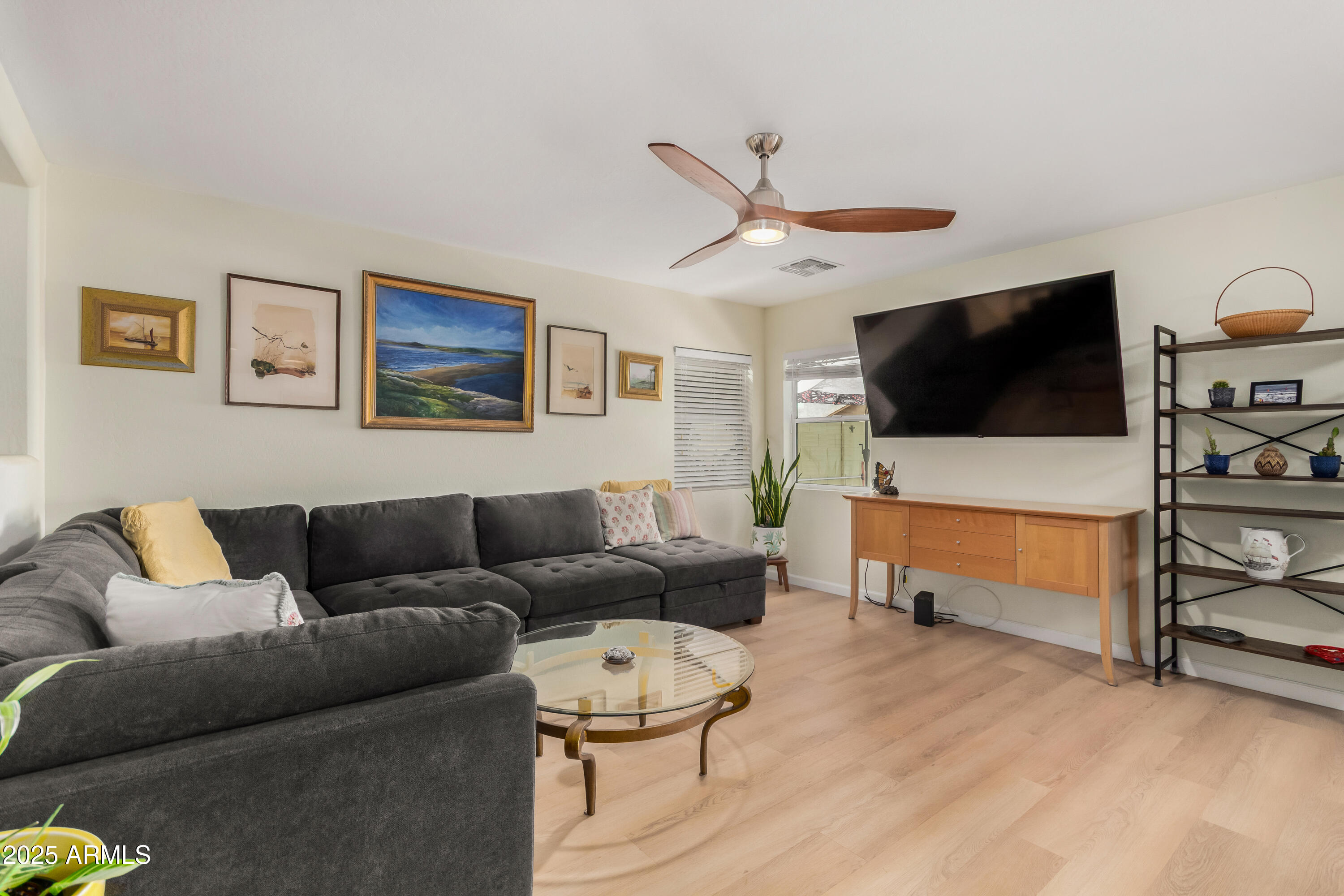 4586 East Silverbell Road San Tan Valley, AZ 85143 - Photo 6 of 32 a living room with furniture and a flat screen tv