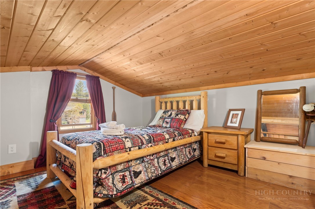 139 Golden Rod Loop Newland, NC 28657 - Photo 27 of 39 a bed room with a bed and a window