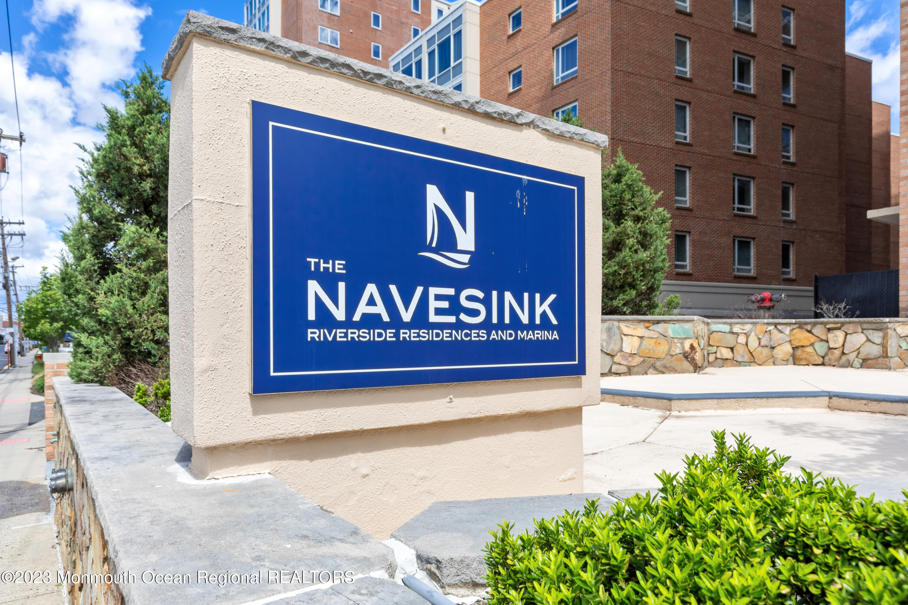 28 Riverside Avenue, Unit 2M Red Bank, NJ 07701 - Photo 29 of 31 a sign broad on the side of a building