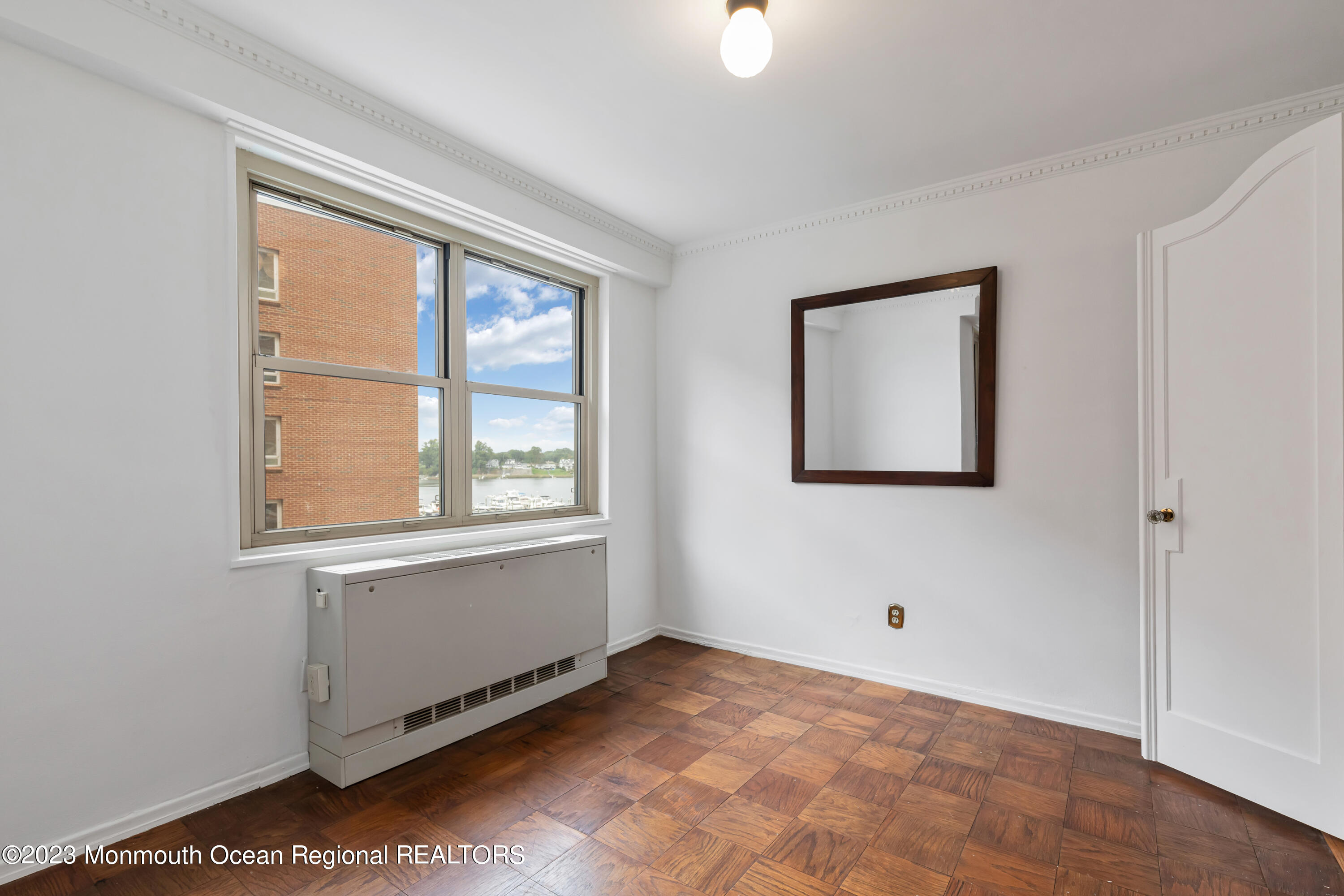 28 Riverside Avenue, Unit 2M Red Bank, NJ 07701 - Photo 3 of 31 a view of an empty room with a window