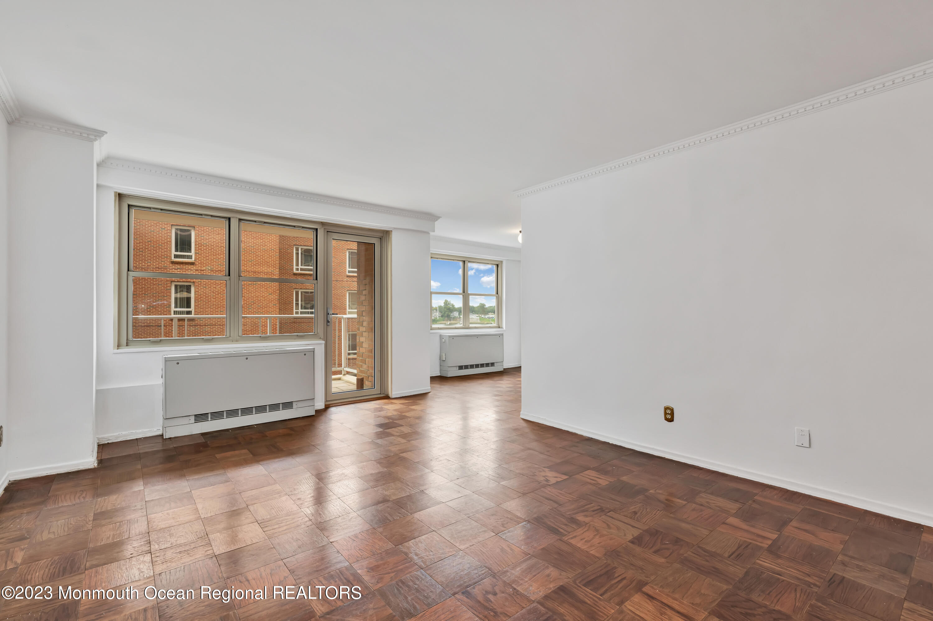 28 Riverside Avenue, Unit 2M Red Bank, NJ 07701 - Photo 9 of 31 an empty room with windows