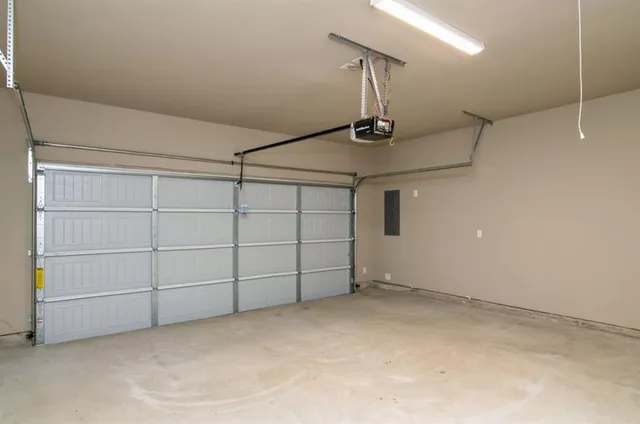 a view of an empty room with wooden fence