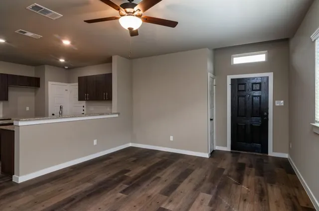 a view of a kitchen with a sink and dishwasher