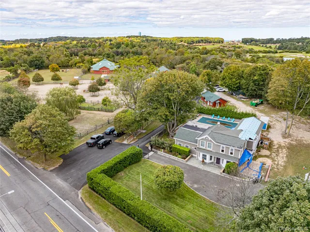 an aerial view of a house with a ocean view