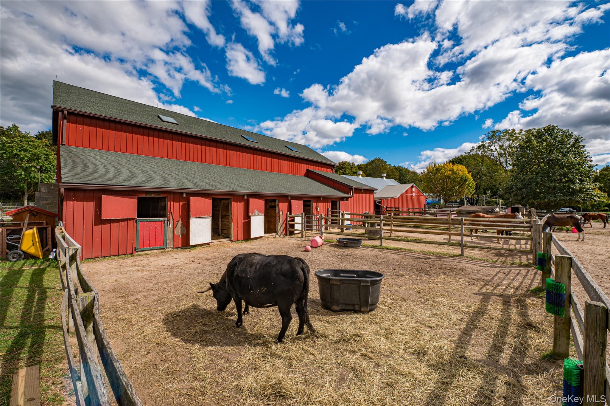 2746 Sound Avenue Riverhead, NY 11901 - Photo 27 of 44 a view of a patio with table and chairs and a barbeque