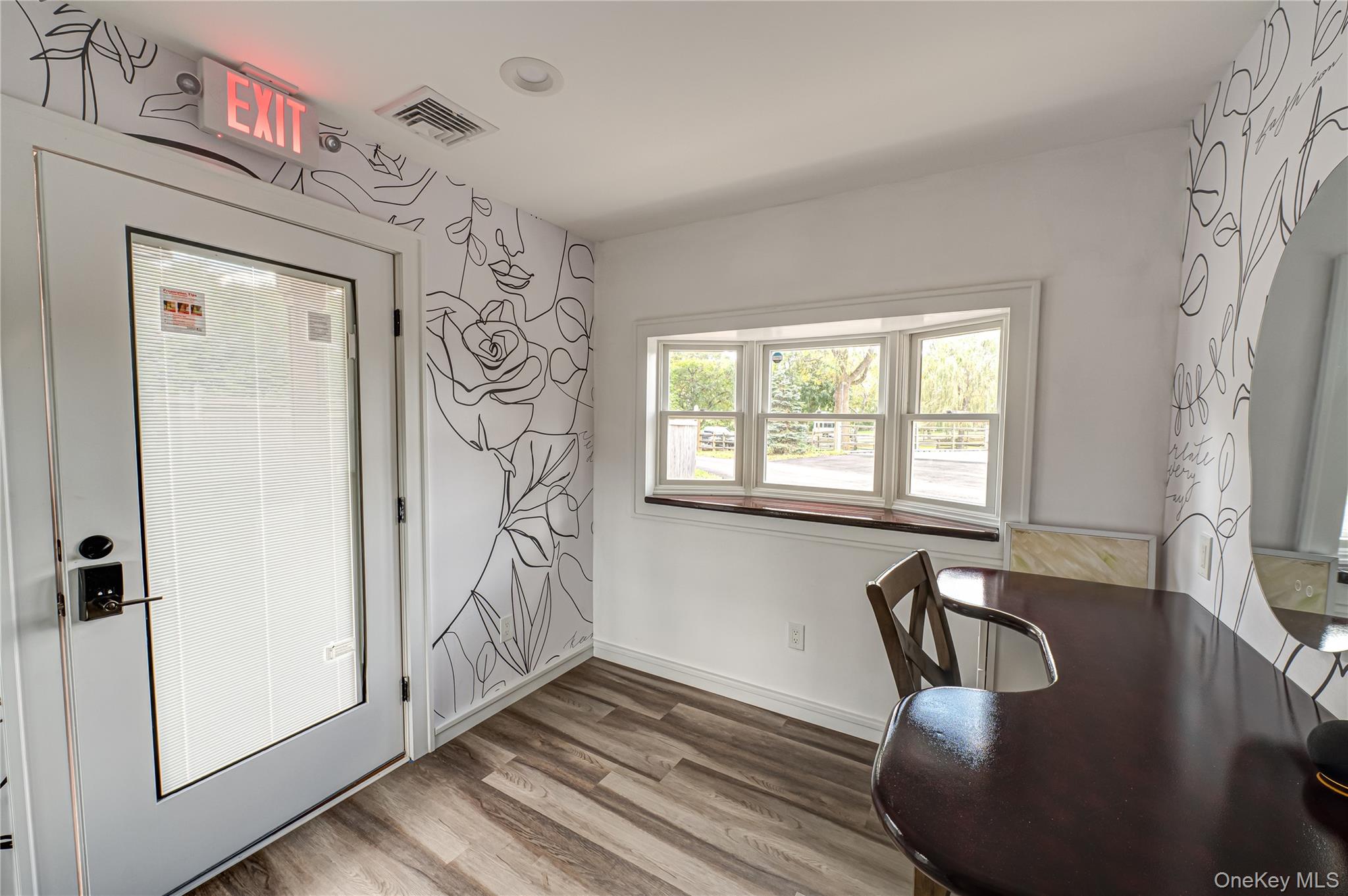 2746 Sound Avenue Riverhead, NY 11901 - Photo 7 of 44 a view of a dining room with furniture window and wooden floor