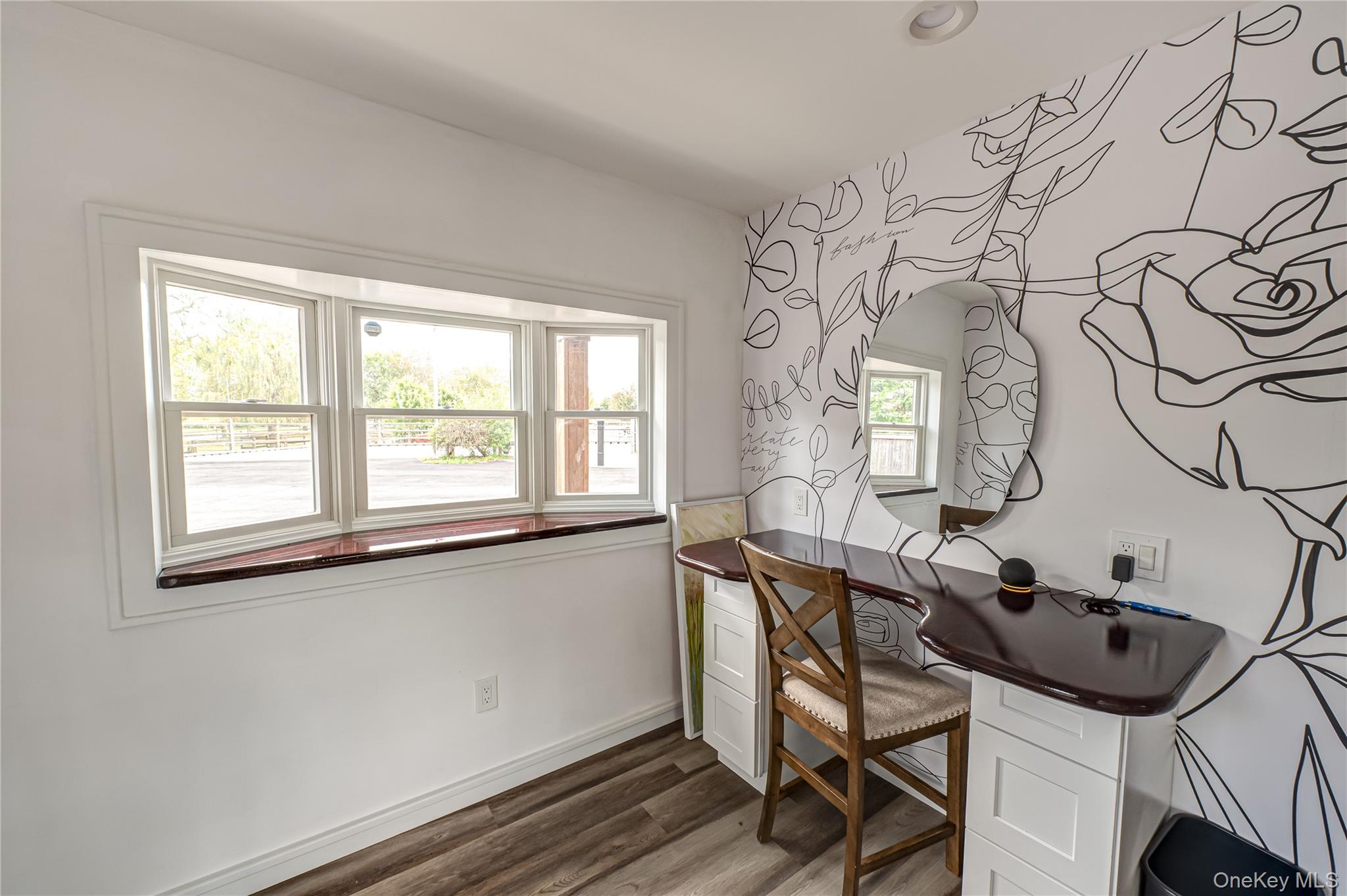 2746 Sound Avenue Riverhead, NY 11901 - Photo 8 of 44 a view of a workspace with furniture and a window