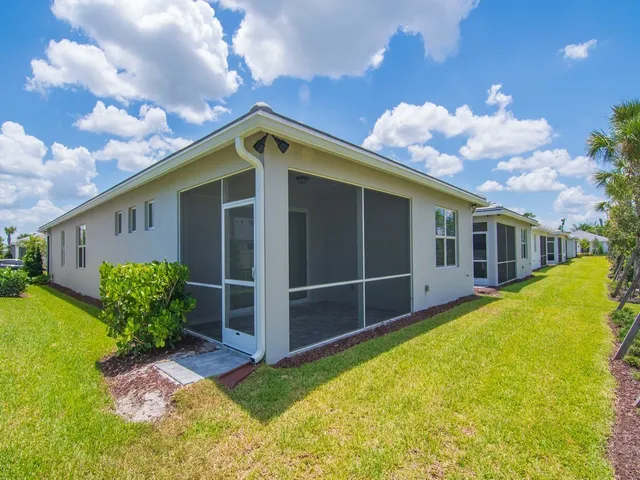 a front view of house with yard and entertaining space