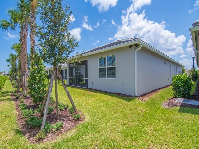 a house with swimming pool in front of it