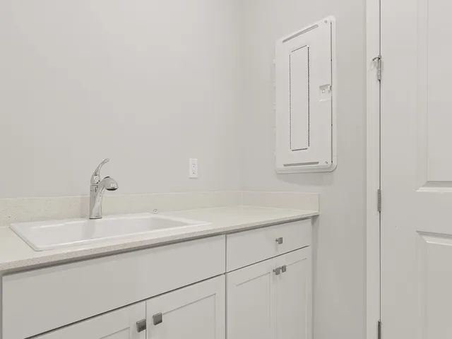 a bathroom with a sink and vanity