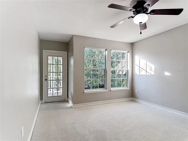 a view of an empty room with a window