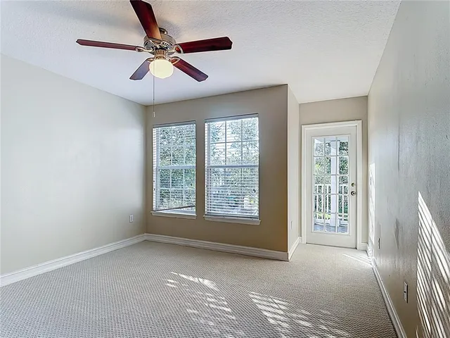 a view of a livingroom with an empty space and a window