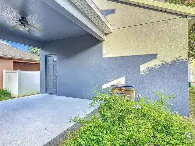 an aerial view of a house with a yard and garden