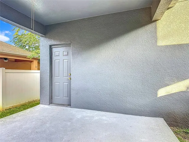 an aerial view of a house with a yard and garden