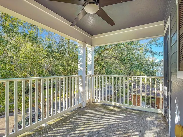 a view of a balcony with furniture
