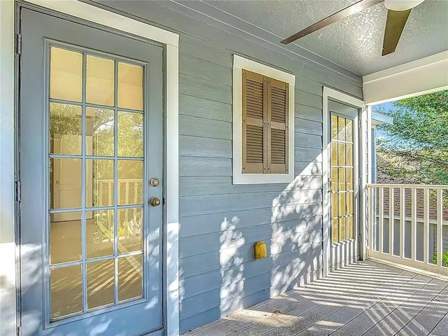 a view of a balcony with wooden floor