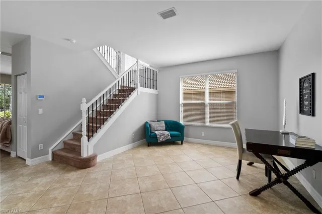 a workspace with furniture and a window