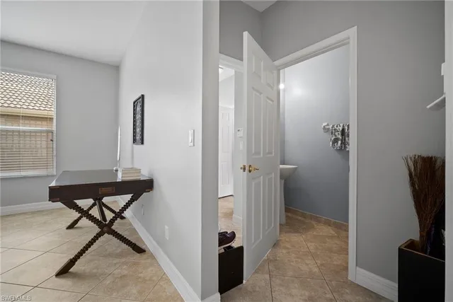 a view of a livingroom with furniture and a window
