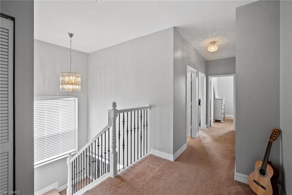 1384 Areca Cove Naples, FL 34119 - Photo 29 of 49 a view of a hallway with workspace
