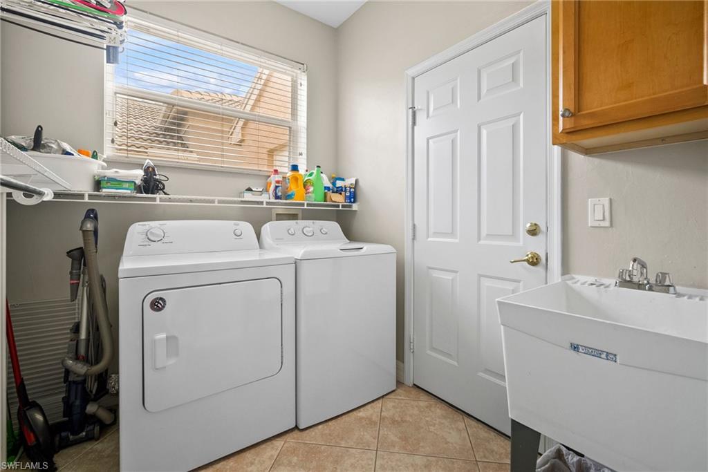 1384 Areca Cove Naples, FL 34119 - Photo 43 of 49 a utility room with dryer and washer