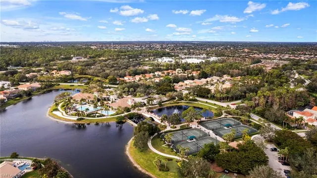 an aerial view of a house with a swimming pool yard and outdoor seating