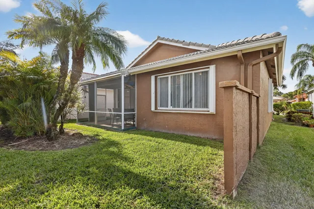a view of a swimming pool with an outdoor seating