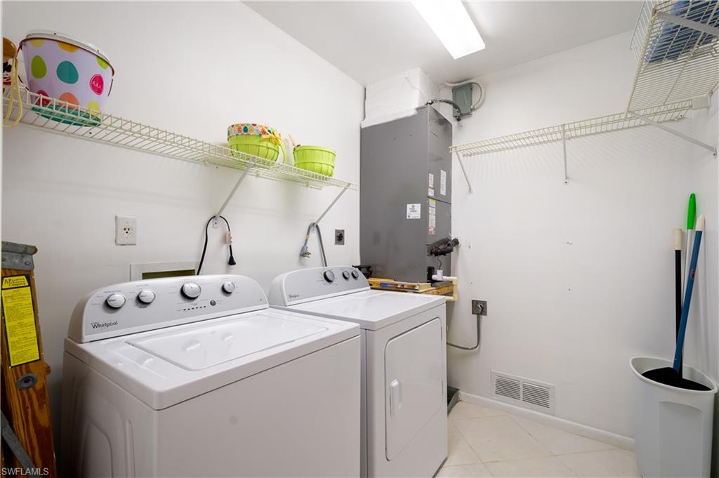 5693 Rattlesnake Hammock Road, Unit 201A Naples, FL 34113 - Photo 4 of 21 Laundry room
