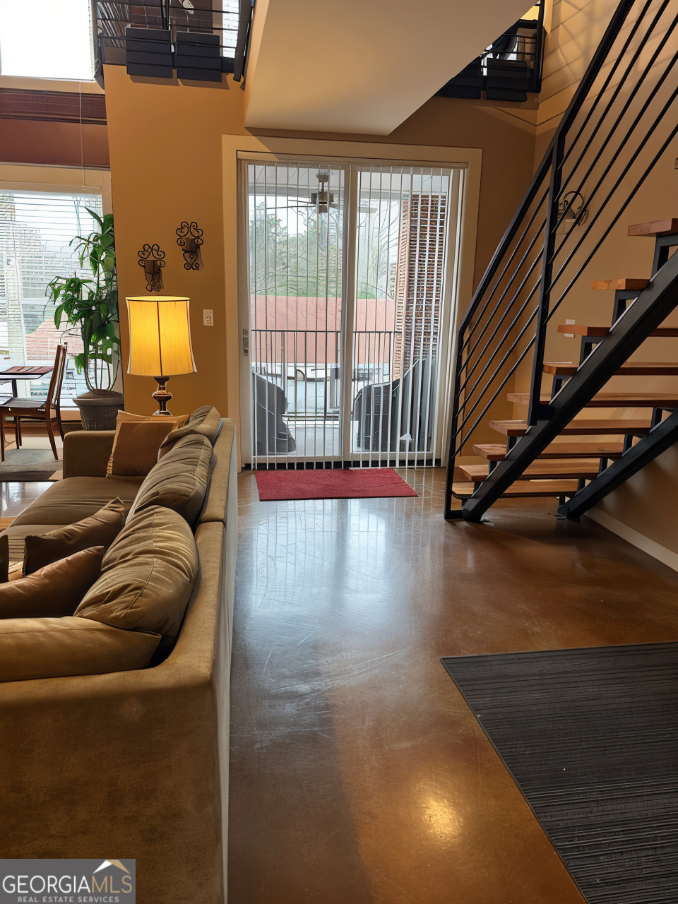 1133 Church Street, Unit 1 Covington, GA 30014 - Photo 13 of 26 a living room with furniture and a floor to ceiling window