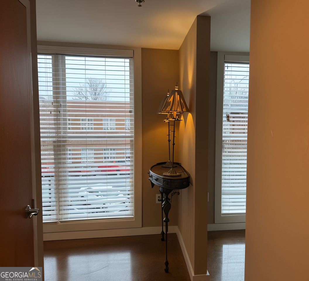 1133 Church Street, Unit 1 Covington, GA 30014 - Photo 3 of 26 a view of a room with a window and brick walls