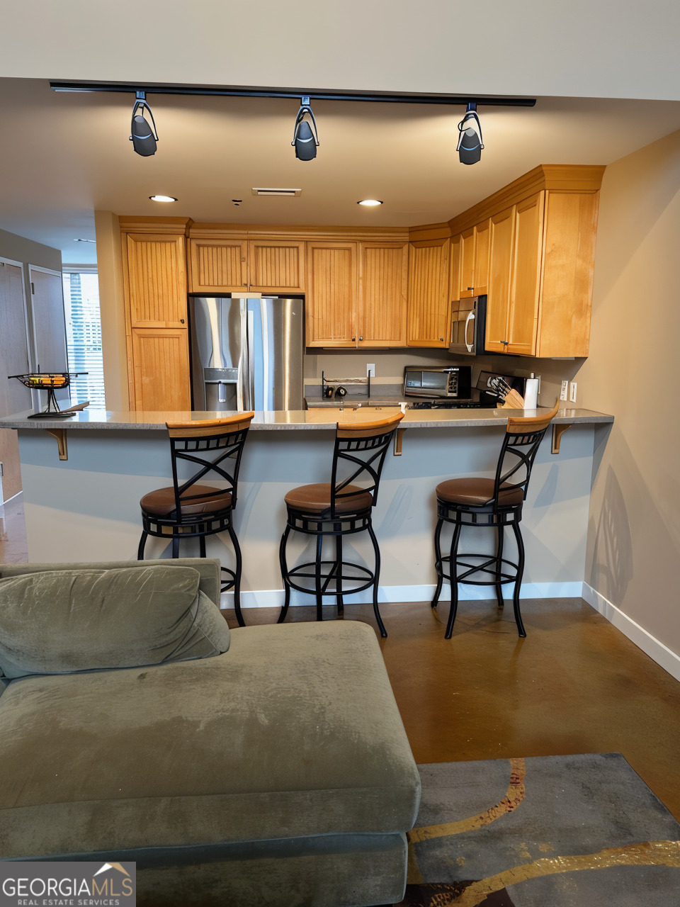 1133 Church Street, Unit 1 Covington, GA 30014 - Photo 10 of 26 a view of a kitchen with dining table and chairs