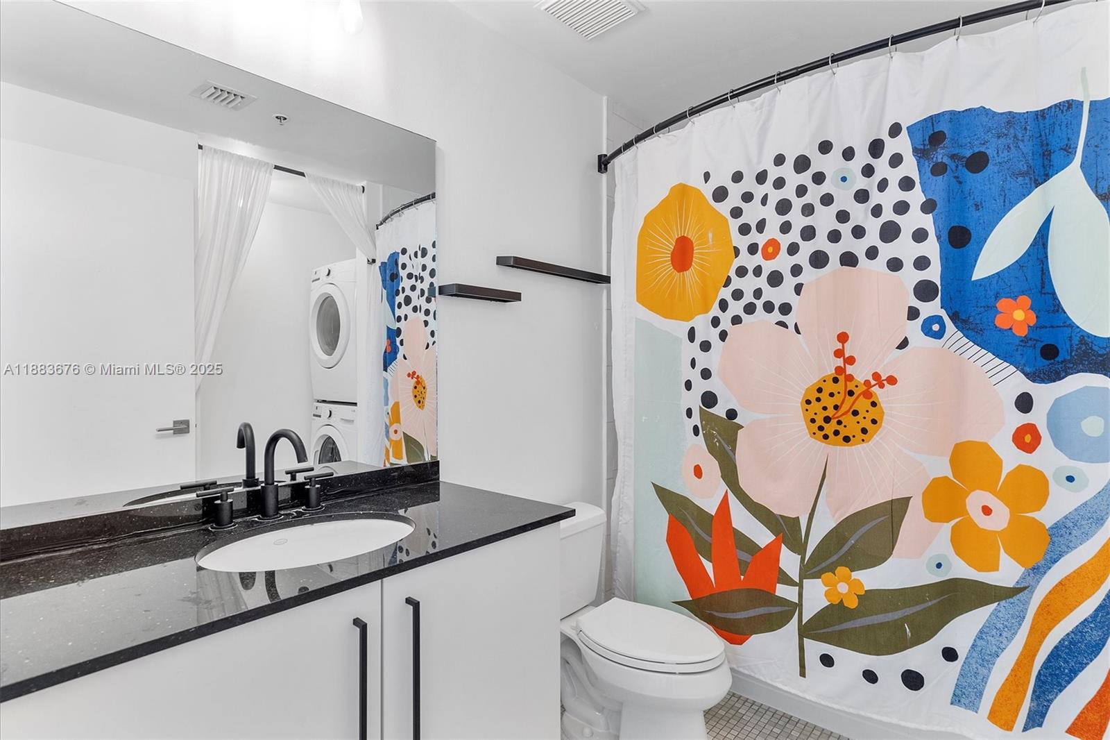 8101 Biscayne Boulevard, Unit R515 Miami, FL 33138 - Photo 12 of 26 a bathroom with a sink mirror vanity and toilet