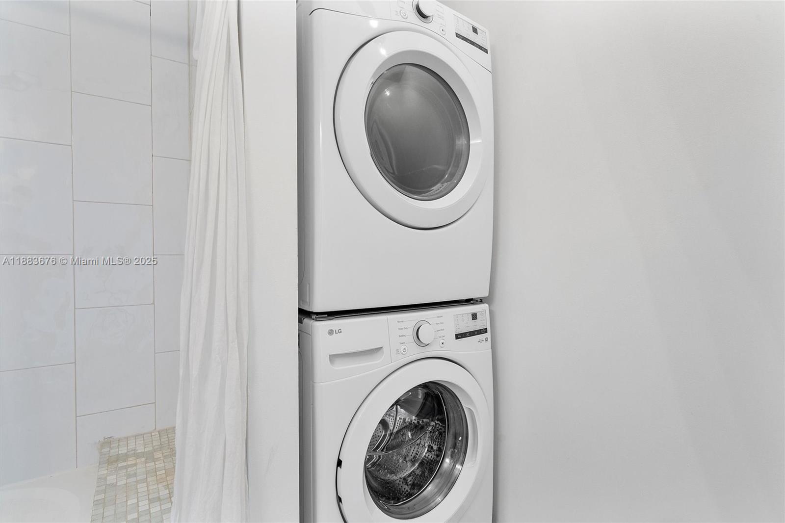 8101 Biscayne Boulevard, Unit R515 Miami, FL 33138 - Photo 13 of 26 a utility room with dryer and washer