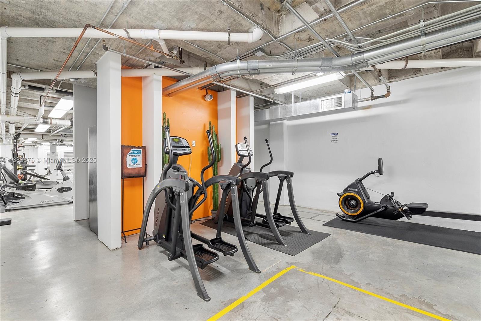 8101 Biscayne Boulevard, Unit R515 Miami, FL 33138 - Photo 17 of 26 a view of a room with gym equipment