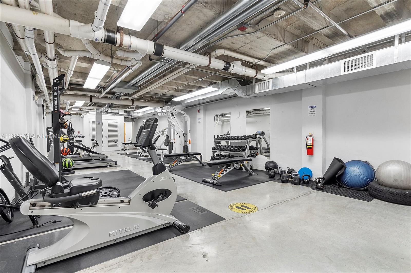 8101 Biscayne Boulevard, Unit R515 Miami, FL 33138 - Photo 20 of 26 a view of a room with gym equipment