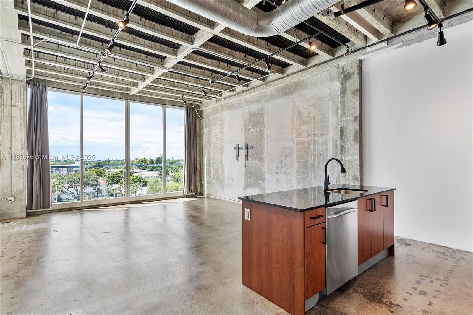 8101 Biscayne Boulevard, Unit R515 Miami, FL 33138 - Photo 2 of 26 a view of a room with stainless steel appliances wooden floor and windows
