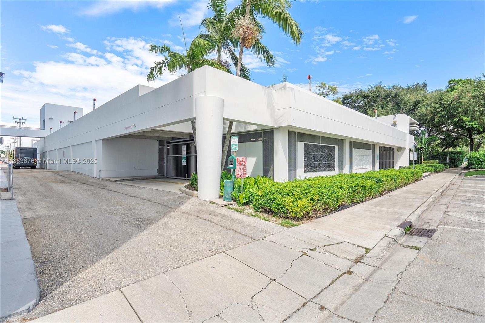 8101 Biscayne Boulevard, Unit R515 Miami, FL 33138 - Photo 25 of 26 a front view of a house with a yard and potted plants